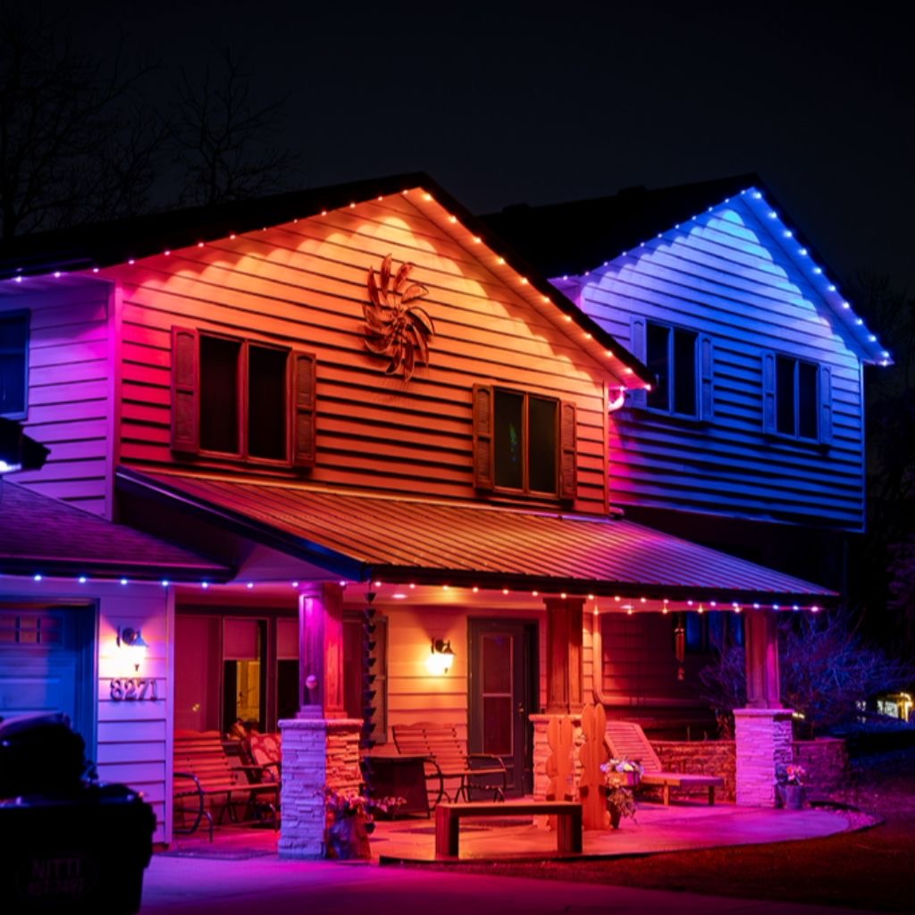 Two-story home washed in multicolor permanent LED lighting